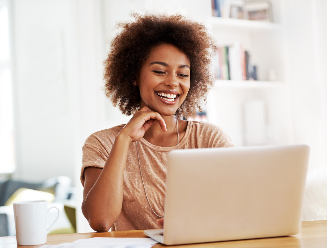 Smiling woman with laptop